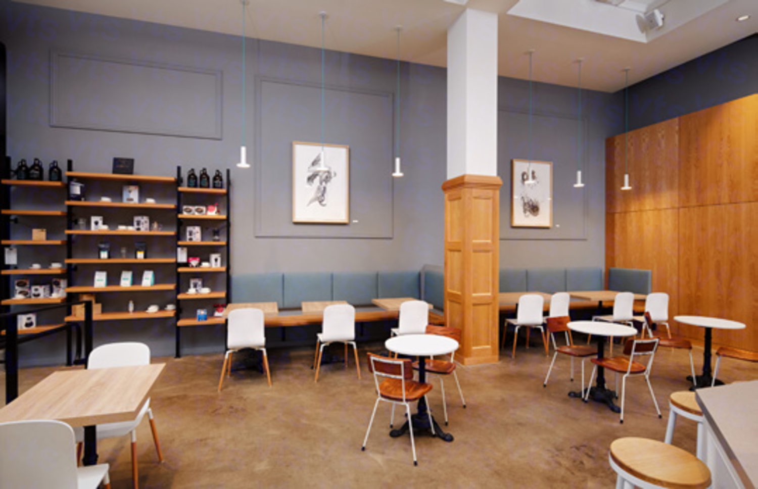 A high ceiling communal area with hanging lights and tables and chairs lined along the walls